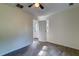 This bedroom features a ceiling fan, and a door that leads to the exterior at 2657 Oregon Ave, North Charleston, SC 29405