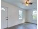Well-lit bedroom with laminate floors, light walls, and white trim at 2657 Oregon Ave, North Charleston, SC 29405