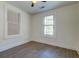 Bedroom with wood-look flooring and two bright windows to let in natural light at 2657 Oregon Ave, North Charleston, SC 29405
