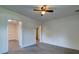 Open bedroom featuring light walls, laminate flooring, and an open doorway at 2657 Oregon Ave, North Charleston, SC 29405