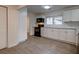 Kitchen features white cabinets, light countertops, and a window that brings in natural light at 2657 Oregon Ave, North Charleston, SC 29405