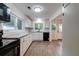 Modern kitchen featuring white cabinets, granite countertops, and stainless steel appliances at 2657 Oregon Ave, North Charleston, SC 29405