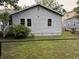 Light blue home with fenced in backyard and visible windows at 2749 E Surrey Dr, North Charleston, SC 29405