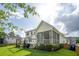 Spacious backyard with a screened-in porch and an outdoor dining area at 2828 Wagner Way, Mount Pleasant, SC 29466
