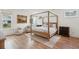 Bright bedroom with a four-poster bed, hardwood floors, and cozy decor at 2828 Wagner Way, Mount Pleasant, SC 29466