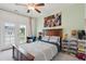 Bedroom featuring a ceiling fan, a bed with a gray comforter, and a balcony with views of the neighborhood at 2828 Wagner Way, Mount Pleasant, SC 29466
