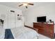 Cozy bedroom with a wood dresser, TV, and a door that leads to an adjoining room at 2828 Wagner Way, Mount Pleasant, SC 29466