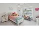 Cozy bedroom with a plush bed, window seat, and personalized decorations at 2828 Wagner Way, Mount Pleasant, SC 29466