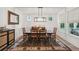 Elegant dining room with a wooden table, stylish rug, and natural light at 2828 Wagner Way, Mount Pleasant, SC 29466