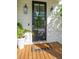 Inviting front door with glass panes, wood floors, and decorative light fixtures at 2828 Wagner Way, Mount Pleasant, SC 29466
