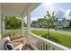 Relaxing front porch with a comfortable chair overlooking the manicured lawn and neighborhood at 2828 Wagner Way, Mount Pleasant, SC 29466