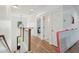 Bright hallway with hardwood floors, white walls, and view into the bedroom at 2828 Wagner Way, Mount Pleasant, SC 29466