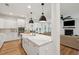 Open concept kitchen with quartz counters, stainless appliances, and view into living room at 2828 Wagner Way, Mount Pleasant, SC 29466