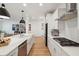 Spacious kitchen with stainless steel appliances, quartz counters, gas cooktop, and breakfast bar at 2828 Wagner Way, Mount Pleasant, SC 29466