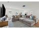 Spacious living room features a large sectional, rug, and charming décor at 2828 Wagner Way, Mount Pleasant, SC 29466