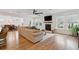Bright living room features hardwood floors, fireplace, ceiling fan, and open floor plan at 2828 Wagner Way, Mount Pleasant, SC 29466
