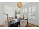 Well-lit home office with natural light, wood floors, and sleek black desk at 2828 Wagner Way, Mount Pleasant, SC 29466