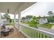 Exterior porch with wood flooring, white railings, and cozy seating at 2828 Wagner Way, Mount Pleasant, SC 29466