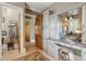 Bathroom with granite countertop, white cabinets, custom mirror and tiled floors at 2834 Parkers Landing Rd, Mount Pleasant, SC 29466