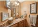 Bathroom features a granite countertop, decorative mirror, and charming accessories at 2834 Parkers Landing Rd, Mount Pleasant, SC 29466