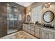 Modern bathroom with granite countertop, dual sink, dark tile, and a glass shower at 2834 Parkers Landing Rd, Mount Pleasant, SC 29466