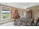 Bedroom with outdoor views, vintage dresser, and stylish window treatments at 2834 Parkers Landing Rd, Mount Pleasant, SC 29466