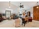 Spacious bedroom with sitting area, ceiling fan, carpet, and sloped ceilings at 2834 Parkers Landing Rd, Mount Pleasant, SC 29466