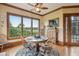 Breakfast nook with hardwood floors, ceiling fan, and large windows offering scenic backyard views at 2834 Parkers Landing Rd, Mount Pleasant, SC 29466