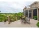 An outdoor deck with cable railing, dining furniture, and amazing backyard views at 2834 Parkers Landing Rd, Mount Pleasant, SC 29466