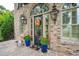 Charming entrance with decorative wreath, potted plants, and brick walkway at 2834 Parkers Landing Rd, Mount Pleasant, SC 29466