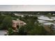 Luxury home with beautiful landscaping, and a view of the waterway and lush trees at 2834 Parkers Landing Rd, Mount Pleasant, SC 29466