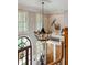 Grand foyer featuring a decorative chandelier, arched entry and staircase with wood banister at 2834 Parkers Landing Rd, Mount Pleasant, SC 29466