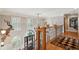 Bright foyer entrance with wooden railings, hardwood floors and staircase at 2834 Parkers Landing Rd, Mount Pleasant, SC 29466