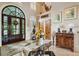 Elegant foyer with dark wood door, arched transom window, tile floor, and deer mounts in a high ceiling entrance at 2834 Parkers Landing Rd, Mount Pleasant, SC 29466