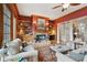 Inviting living room with a fireplace, built-in bookshelves, and access to a stairway, offering a warm ambiance at 2834 Parkers Landing Rd, Mount Pleasant, SC 29466