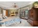 A beautiful, carpeted main bedroom with a ceiling fan and French doors leading to an outdoor balcony at 2834 Parkers Landing Rd, Mount Pleasant, SC 29466