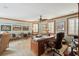 Spacious home office featuring wood trim, built-ins, ceiling fan, and multiple windows for natural light at 2834 Parkers Landing Rd, Mount Pleasant, SC 29466