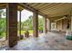 Outdoor patio with brick columns, wood ceiling, stone tile and a view of the backyard at 2834 Parkers Landing Rd, Mount Pleasant, SC 29466