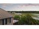 Beautiful view of waterfront property with private dock, lush landscaping and marshlands at 2834 Parkers Landing Rd, Mount Pleasant, SC 29466