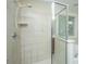 Bright bathroom features a tiled shower with glass door and combination shower-tub at 3005 Macbeth Creek Dr, Charleston, SC 29414