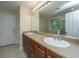 Bathroom features a large mirror, double vanity and shower with glass doors at 3005 Macbeth Creek Dr, Charleston, SC 29414