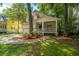 Charming home featuring a lovely front porch, well-maintained lawn, and an attached garage at 3005 Macbeth Creek Dr, Charleston, SC 29414