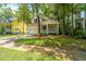Charming home featuring a lovely front porch, well-maintained lawn, and an attached garage at 3005 Macbeth Creek Dr, Charleston, SC 29414