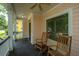 Relax on this charming front porch with rocking chairs and a ceiling fan at 3005 Macbeth Creek Dr, Charleston, SC 29414