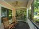 Relax on this charming front porch with rocking chairs and a ceiling fan at 3005 Macbeth Creek Dr, Charleston, SC 29414