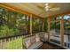 Relax on the screened porch, featuring comfortable seating and a ceiling fan at 3005 Macbeth Creek Dr, Charleston, SC 29414