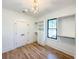 Bright walk-in closet featuring custom shelving, drawers, hardwood floors, and a window at 3898 Summerton Street Dr, Mount Pleasant, SC 29466