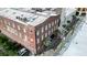 An aerial view of the brick building, street, and nearby buildings at 4 Beaufain St # 207, Charleston, SC 29401