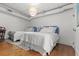 Bedroom showcases two neatly made beds, hardwood floors, and bright airy ambiance at 4 Beaufain St # 207, Charleston, SC 29401