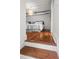 Bedroom with wooden floors and a tray ceiling at 4 Beaufain St # 207, Charleston, SC 29401